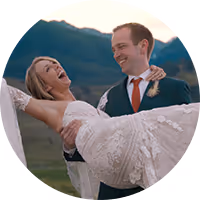 Close-up of a couple with eyes closed, touching foreheads and wearing wedding rings.