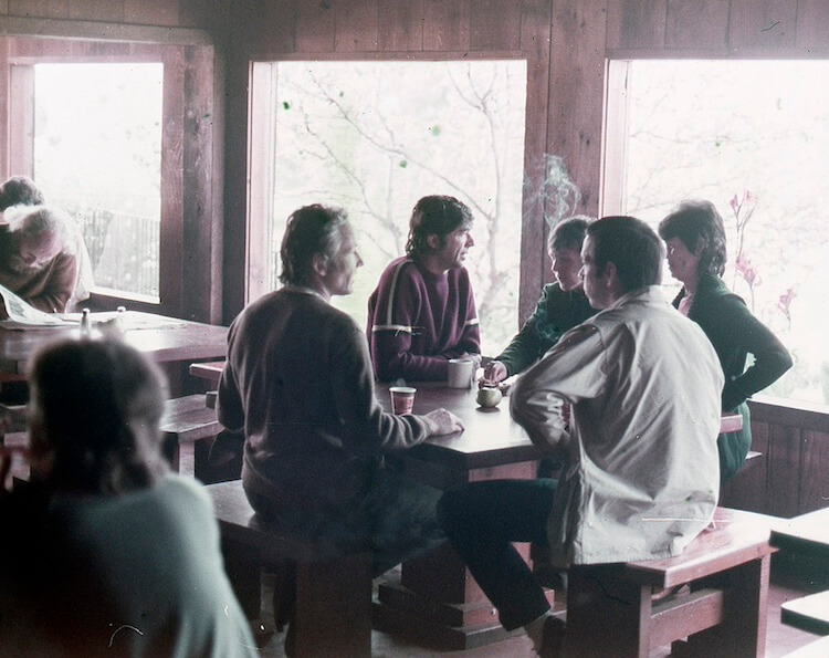 Dick Price, Julian Silverman, Beverly Silverman and Betty Martin in conversation in the Lodge. Credit: Esalen Archives