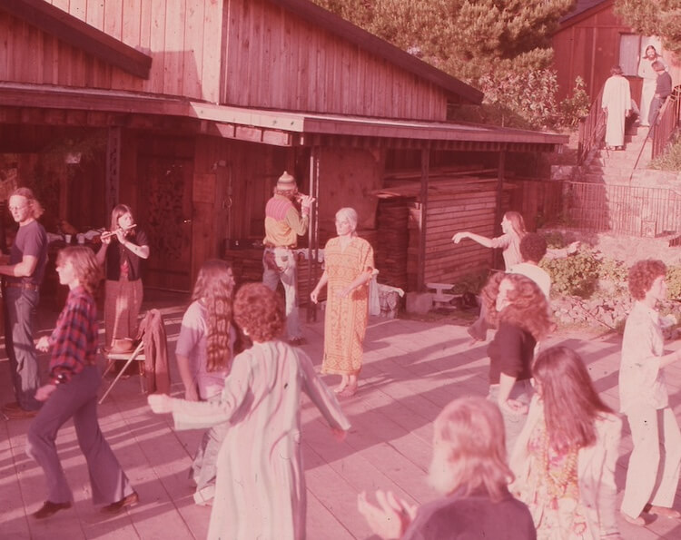 Dancing on the back deck of the Lodge. Credit: Esalen Archives