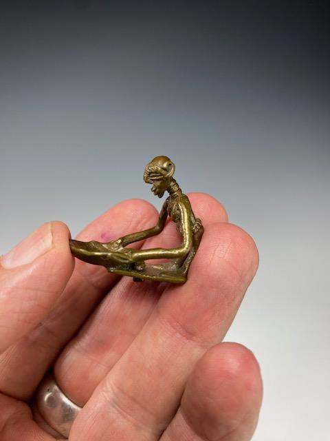 BRONZE GOLD WEIGHT OF A FEMALE FIGURE WITH BOWL. AKAN, GHANA