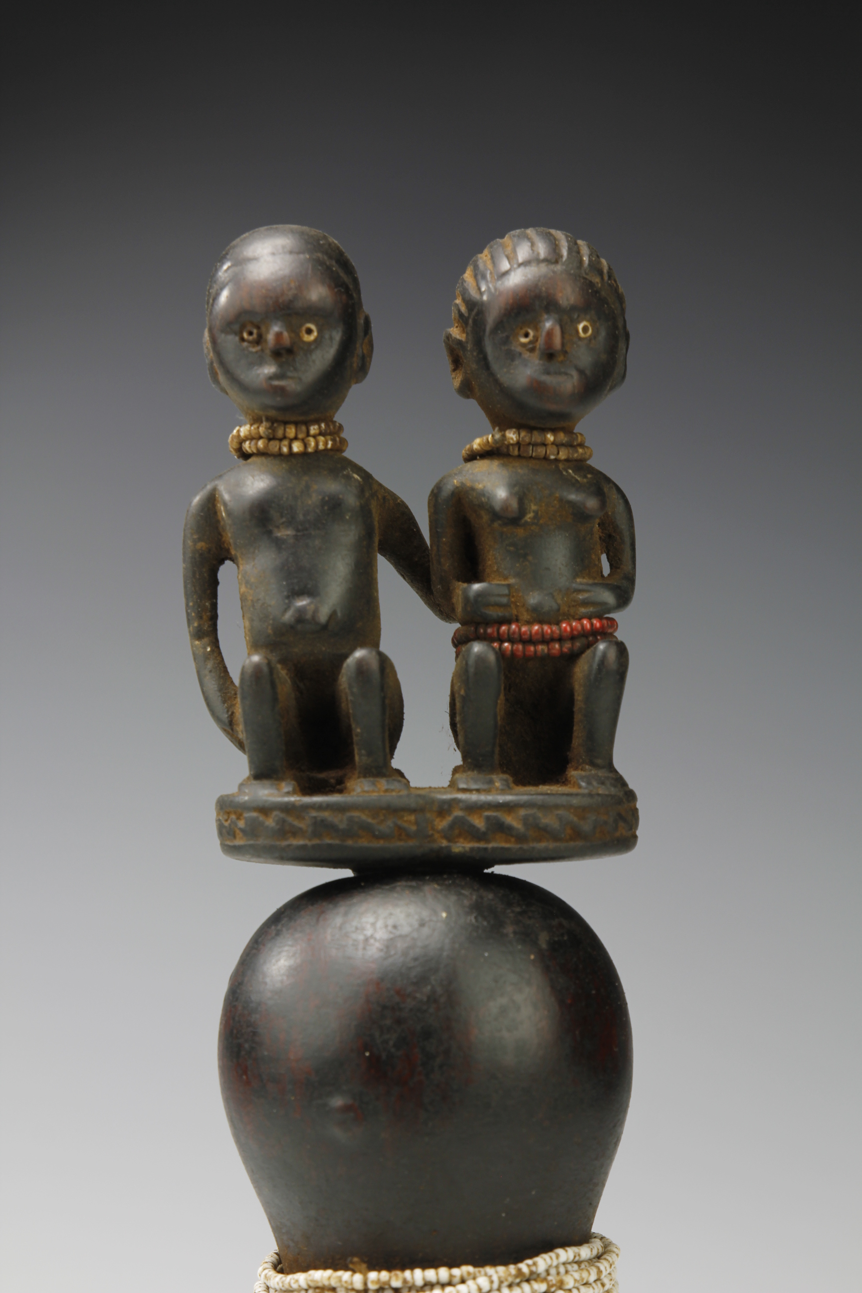 FINE MEDICINE CONTAINER WITH A DOUBLE FIGURATIVE STOPPER. KAGURU,TANZANIA