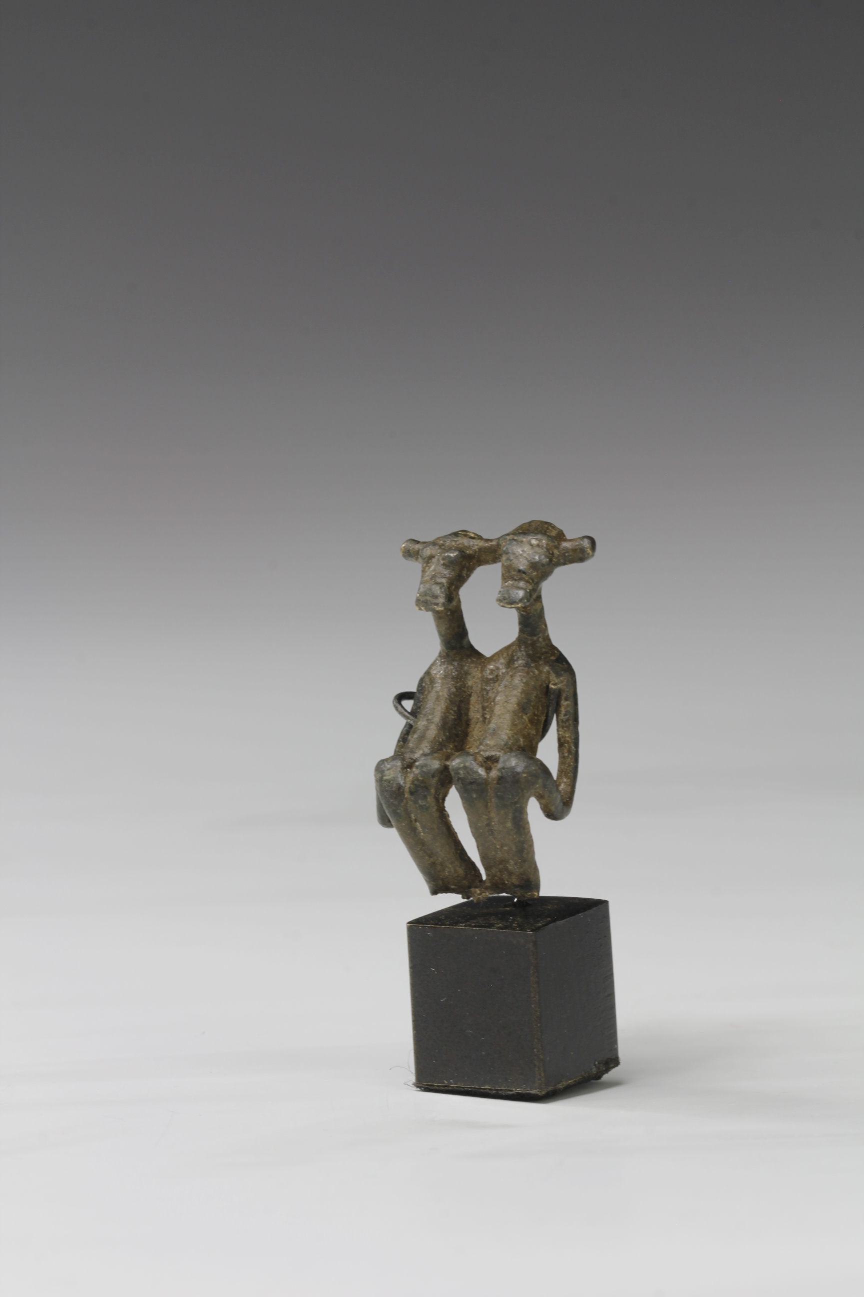 MINIATURE BRONZE AMULET. KULANGO, IVORY COAST 