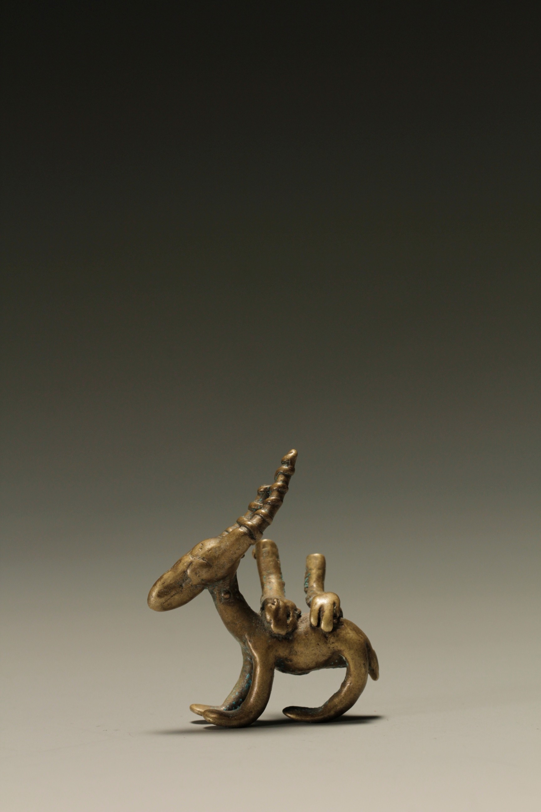UNUSUAL GOLD WEIGHT OF A GAZELLE WITH HUMAN HANDS. AKAN,GHAHA