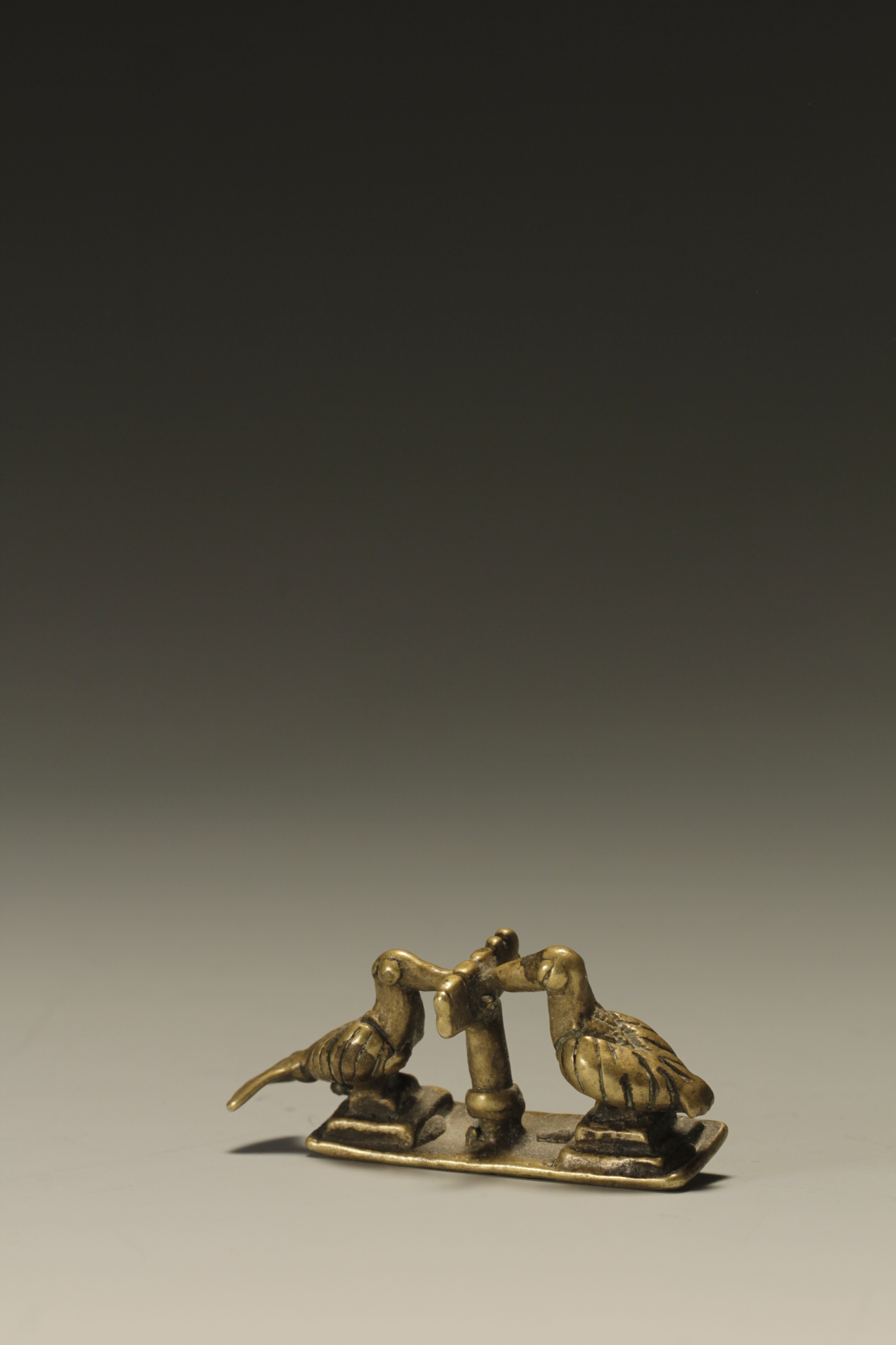 GOLD WEIGHT OF BIRDS ON A STRUCTURE. AKAN, GHANA