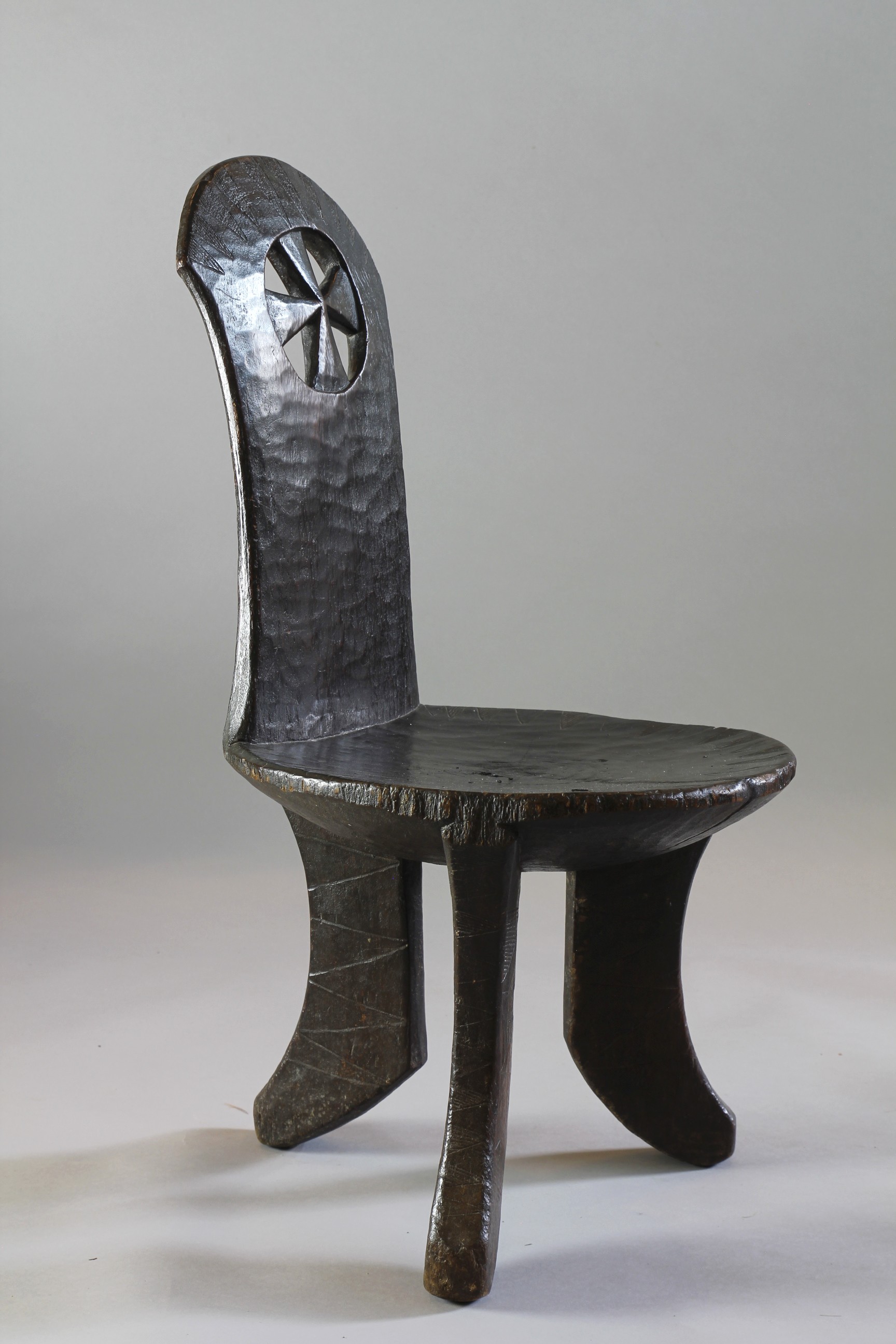 FINE ETHIOPIAN CHAIR WITH CUT OUT CROSS DECORATION