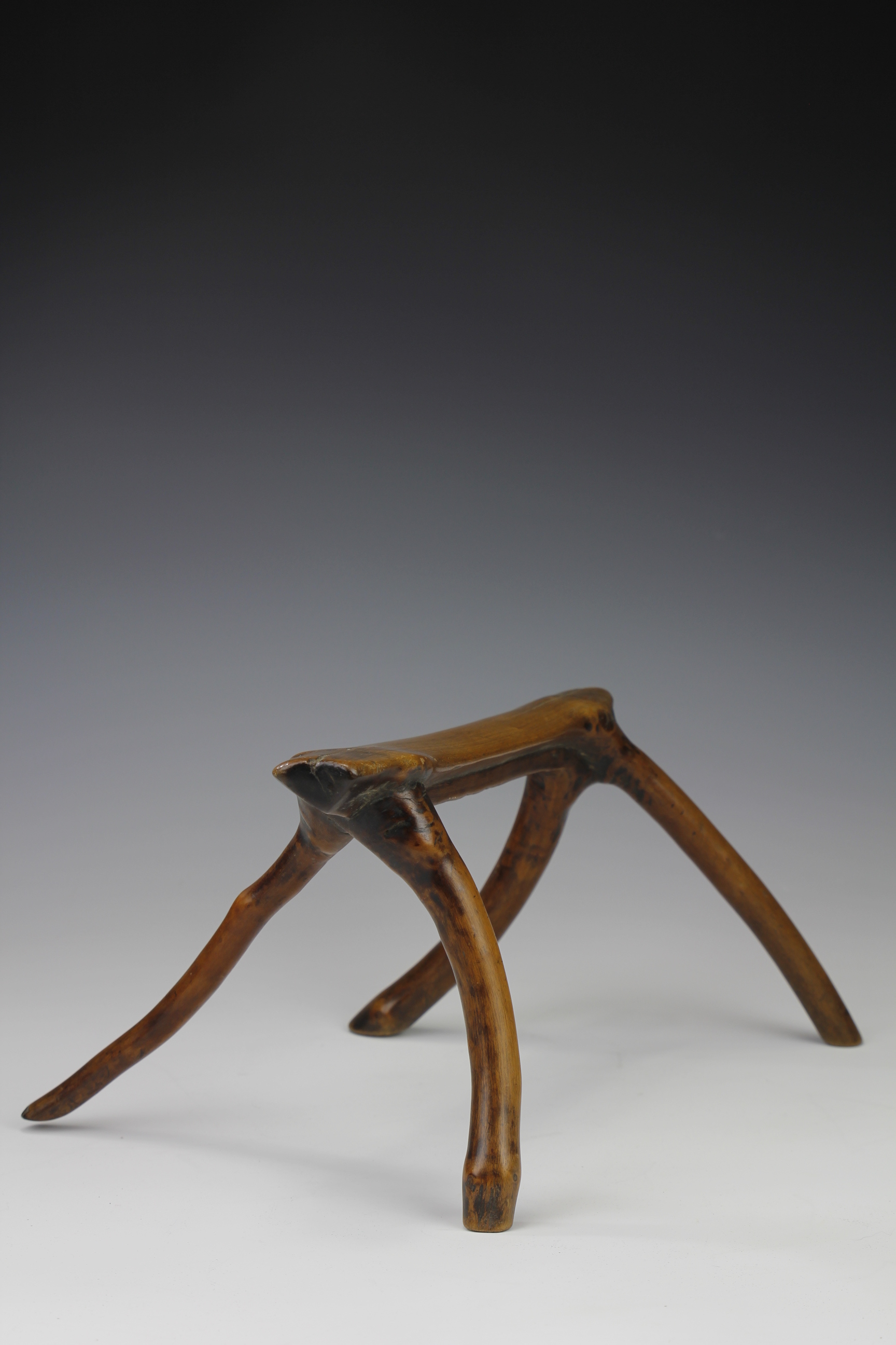 HEADREST/STOOL IN ABSTRACT FORM. NORTHERN UGANDA/SOUTHERN SUDAN