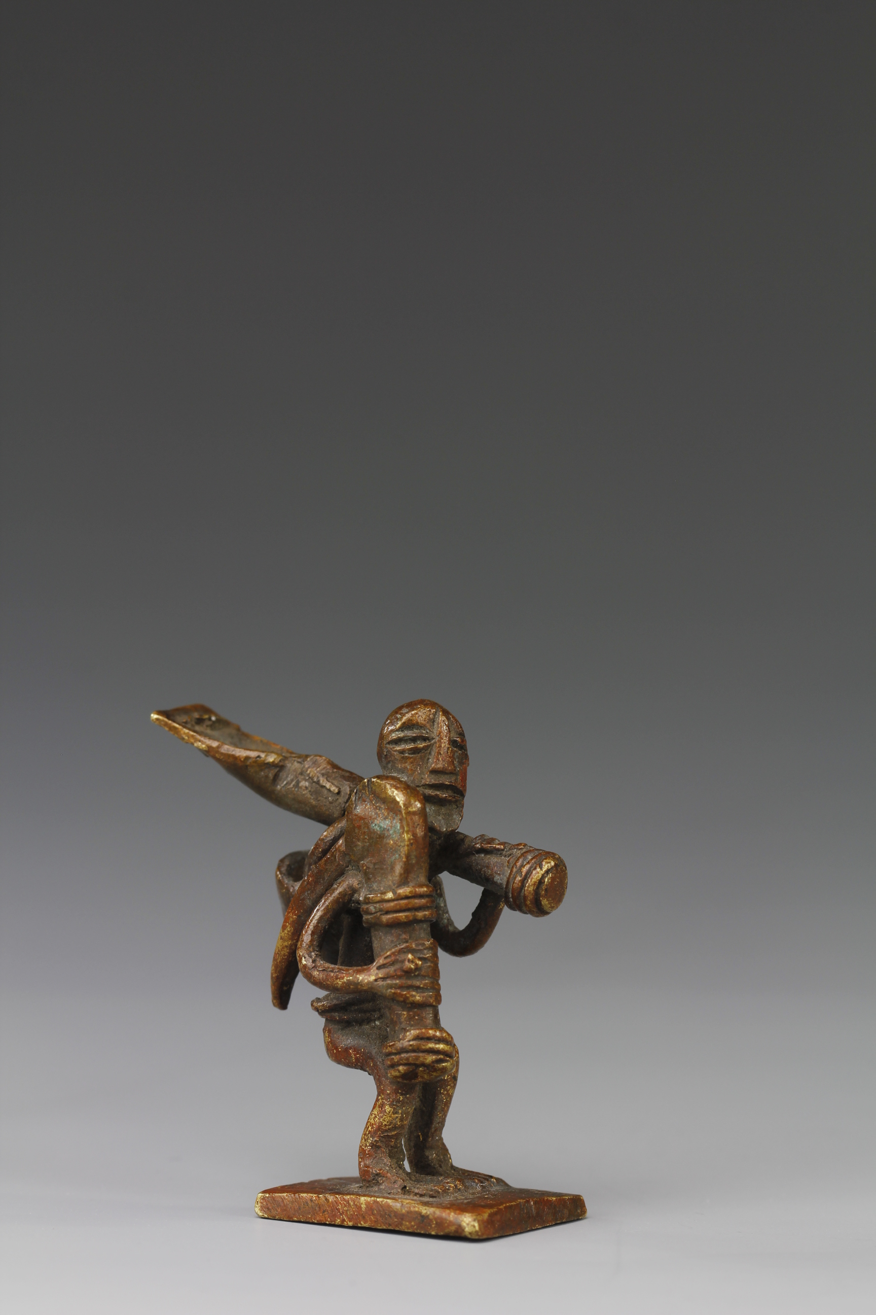 COPPER GOLD WEIGHT OF A FARMER. AKAN, GHANA