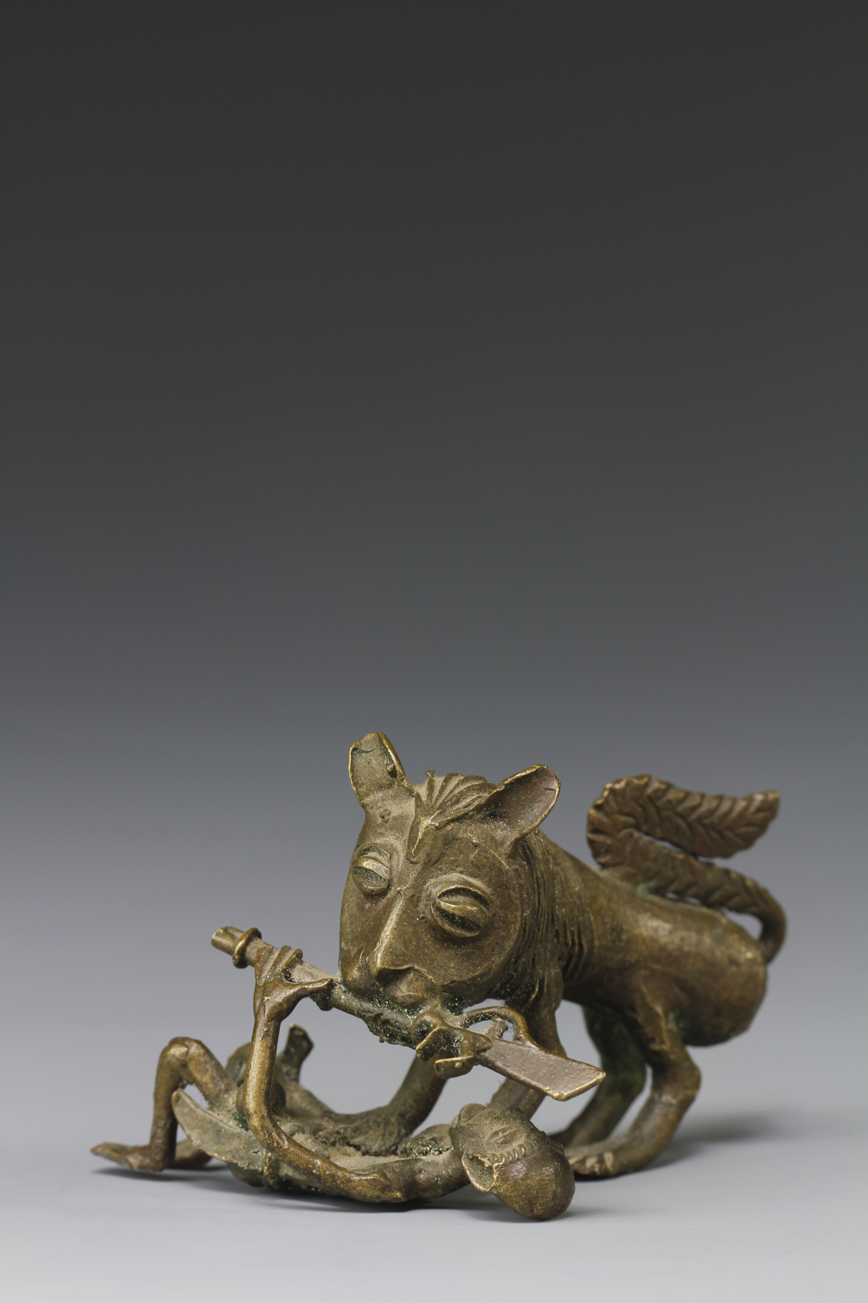 RARE GOLD WEIGHT OF A LION AND HUNTER. AKAN, GHANA
