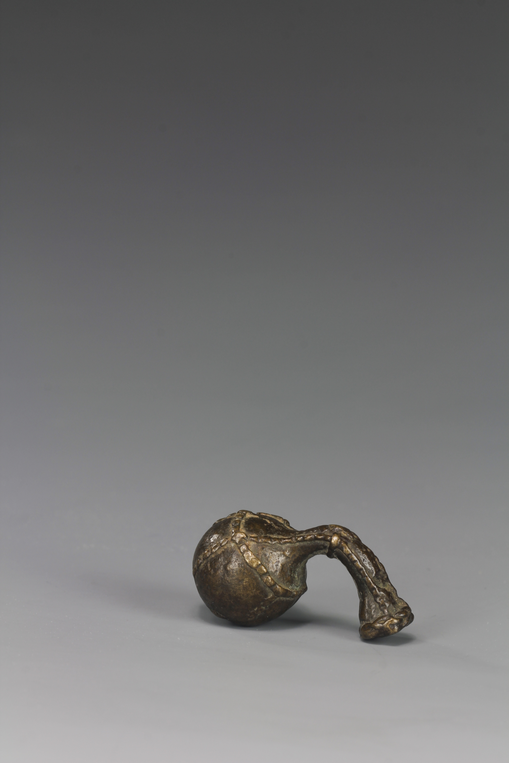GOLD WEIGHT OF A GOURD CONTAINER . AKAN, GHANA