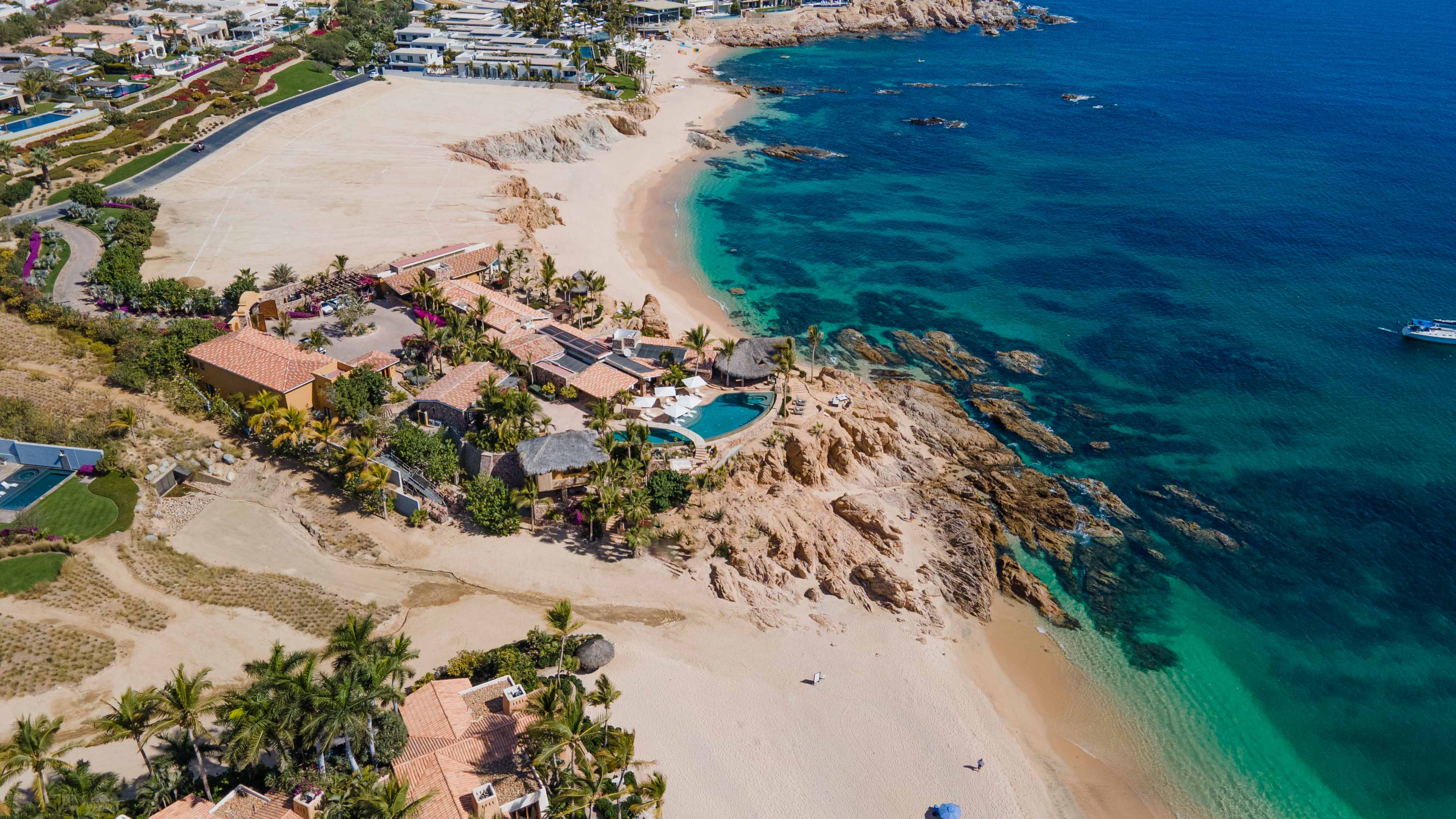 Oceanfront villa Cielito del Mar, a luxury vacation rental home in Chileno Bay, Los Cabos, with chaise lounges, umbrellas, and private plunge pool overlooking the Sea of Cortez