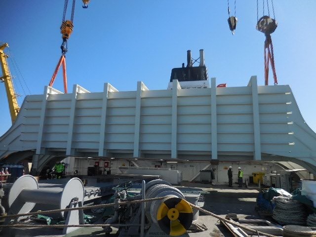 Bluefort's flume tank being lifted into position, installed for stability.