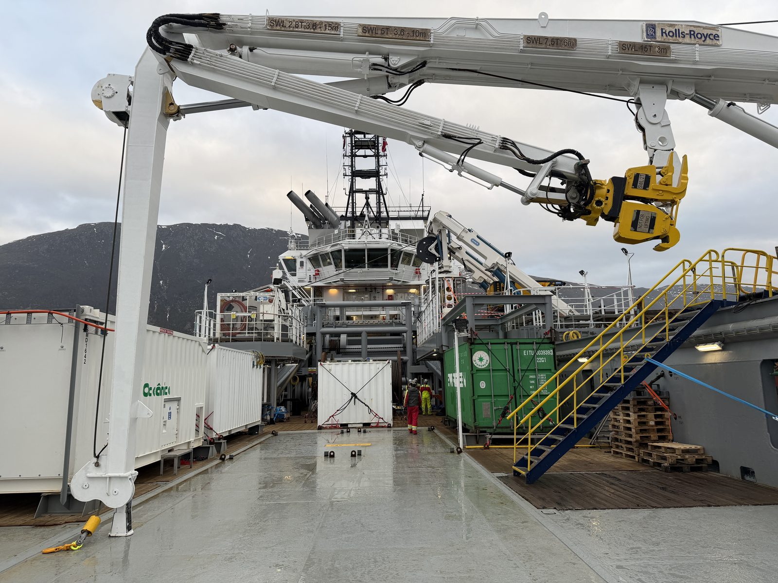 A Rolls-Royce ROV handling crane being installed on Oceanicasub XVII's deck during conversion works, shown in unpainted steel ahead of final fit-out.
