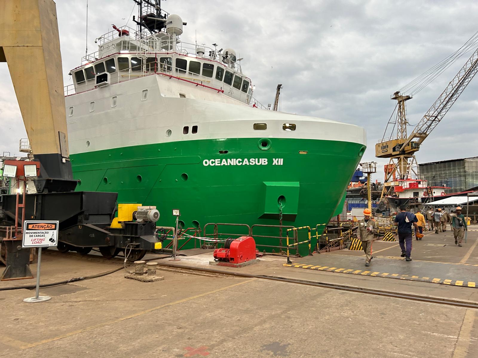 Green-hulled offshore support vessel Oceanicasub XII in drydock, bow view