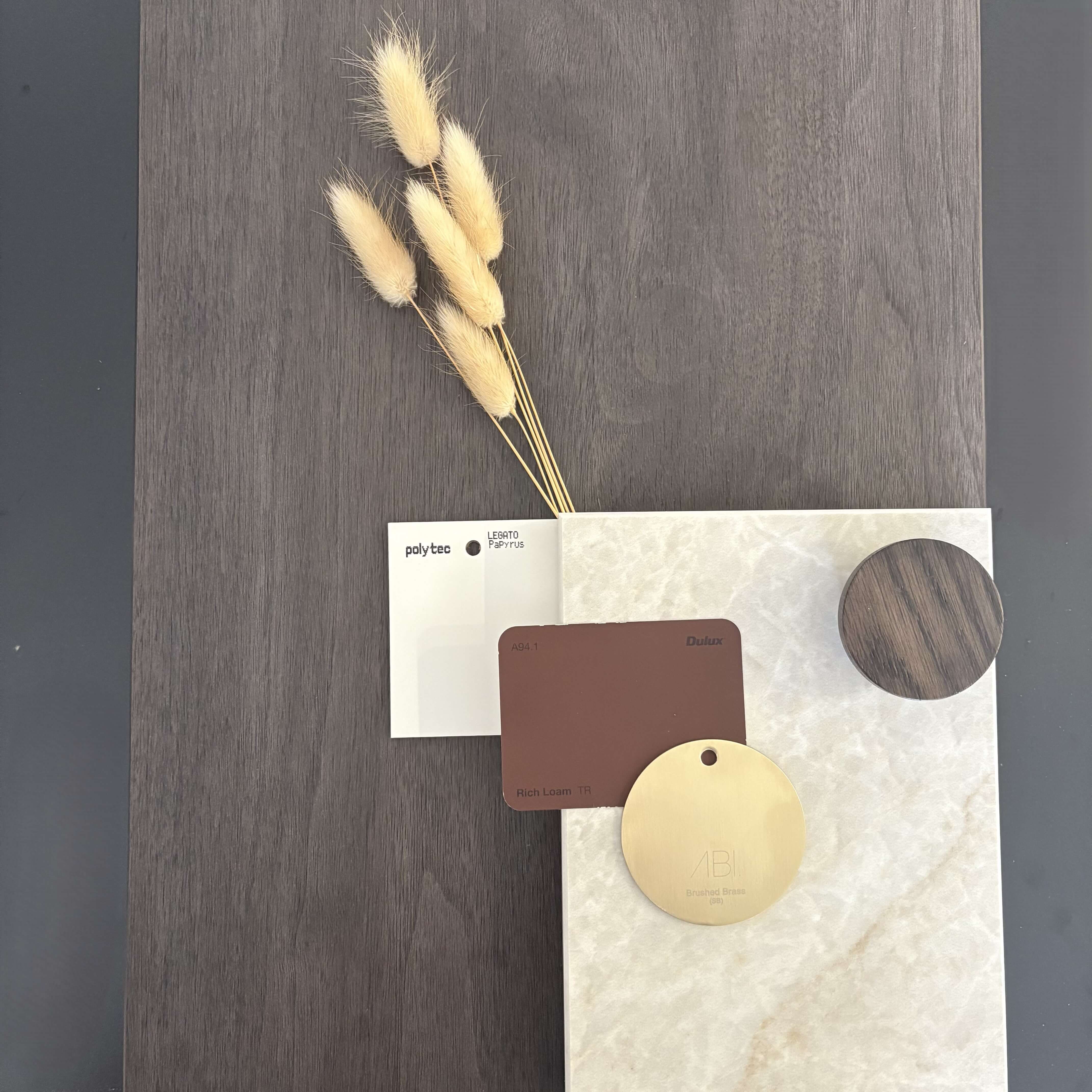 Contemporary kitchen materials palette featuring neutral tones and stone finishes
