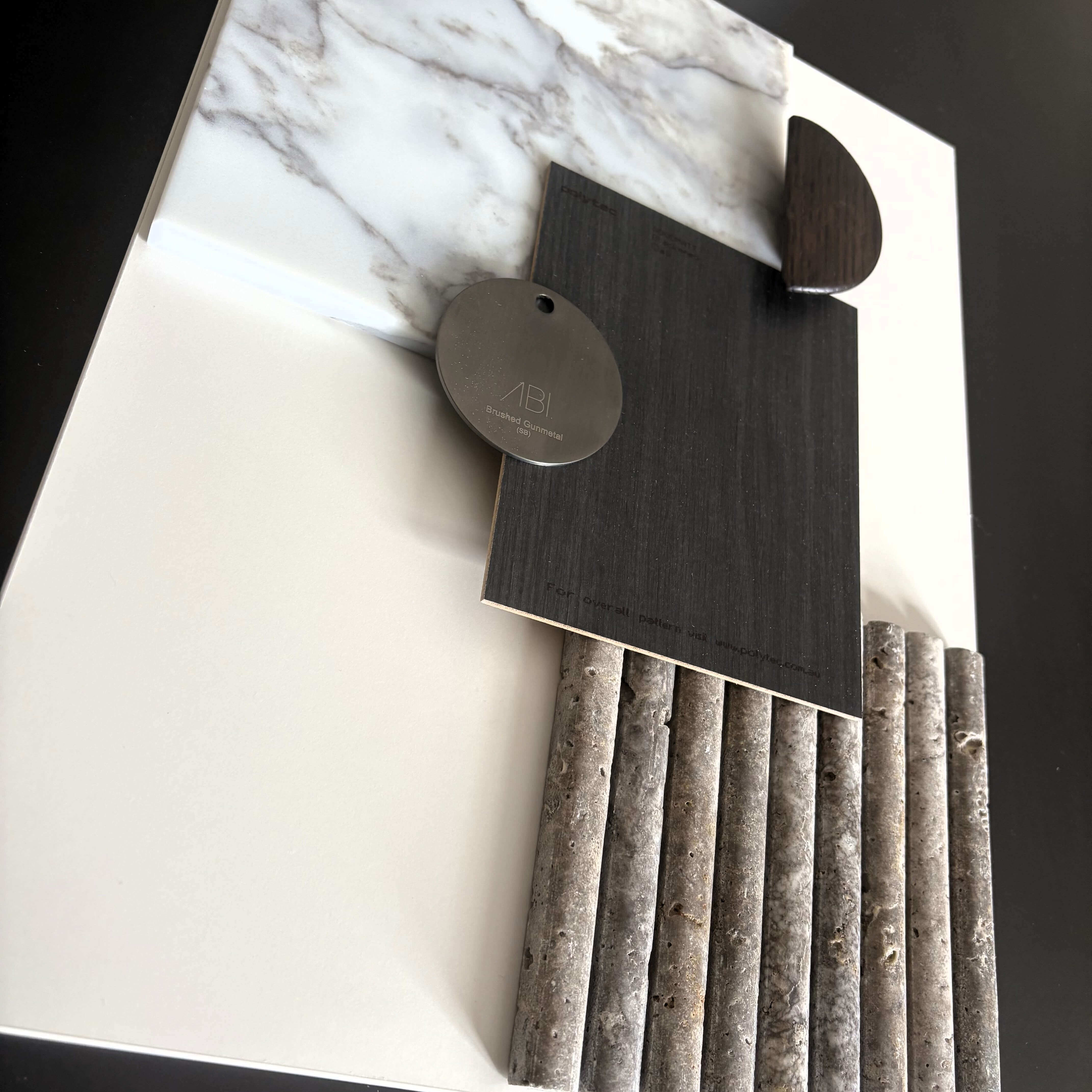 Blackened oak cabinetry paired with white stone benchtop for a modern finish