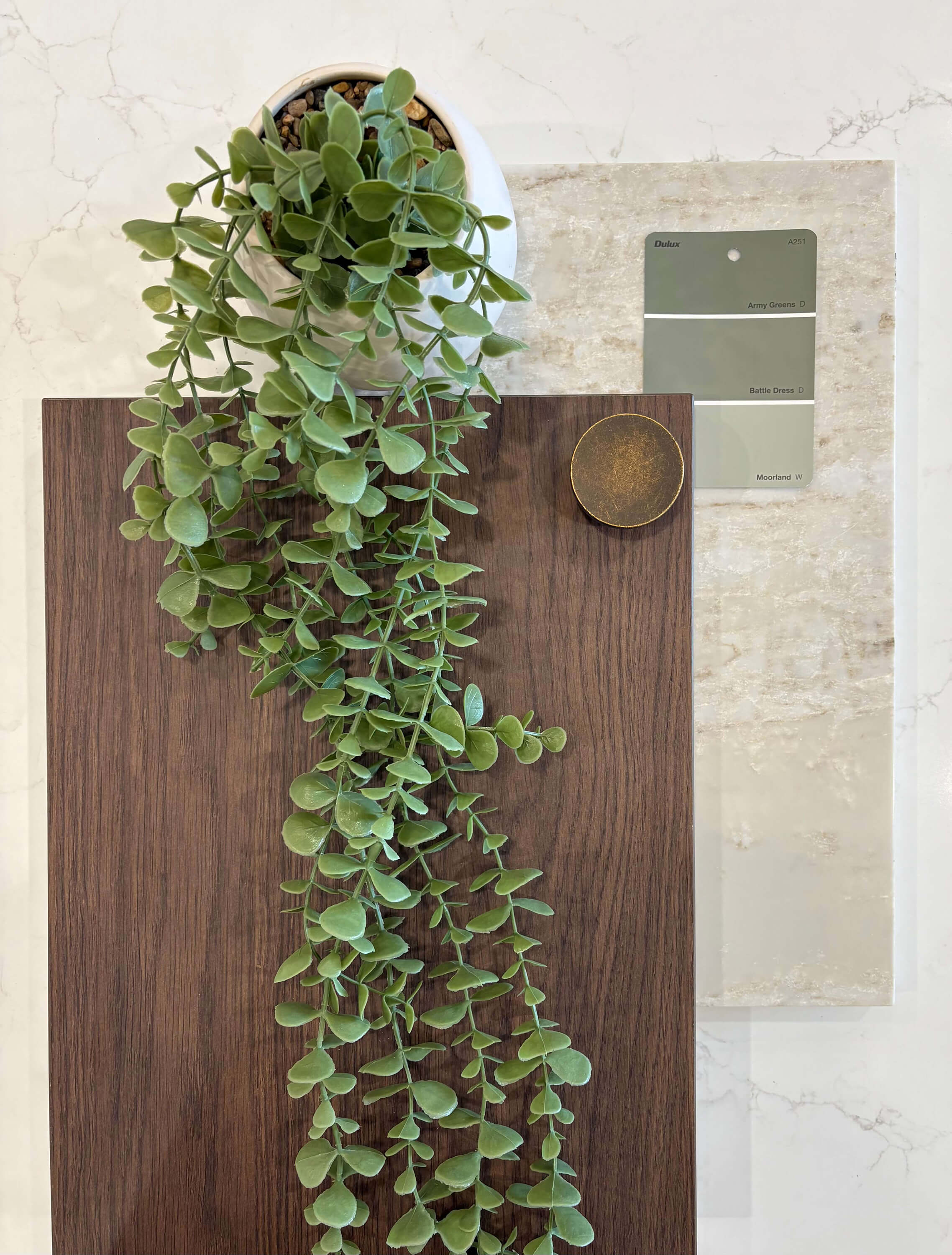 Rubra oak cabinetry paired with bold stone finishes for a striking interior