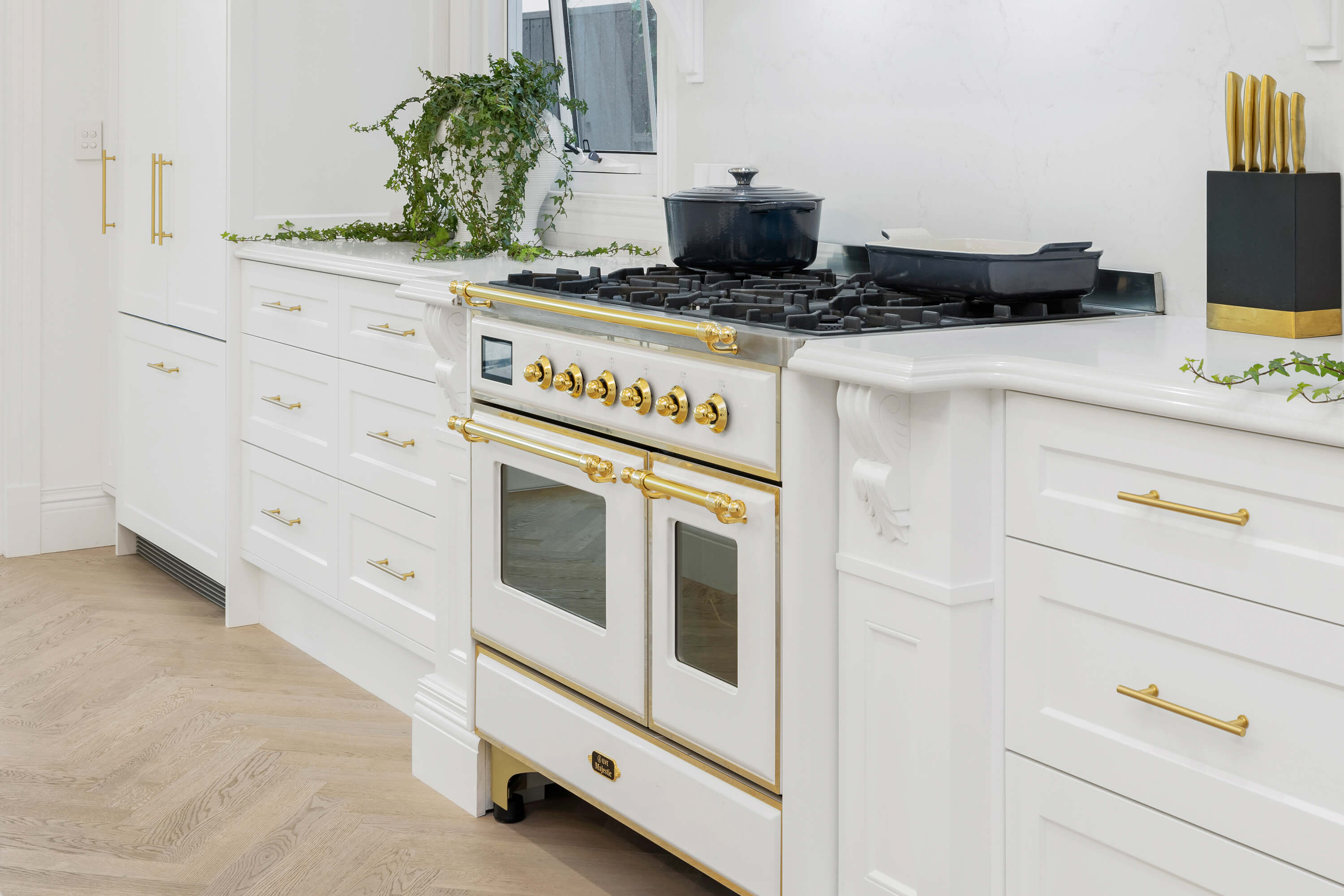 Modern kitchen with custom cabinetry and stone benchtops
