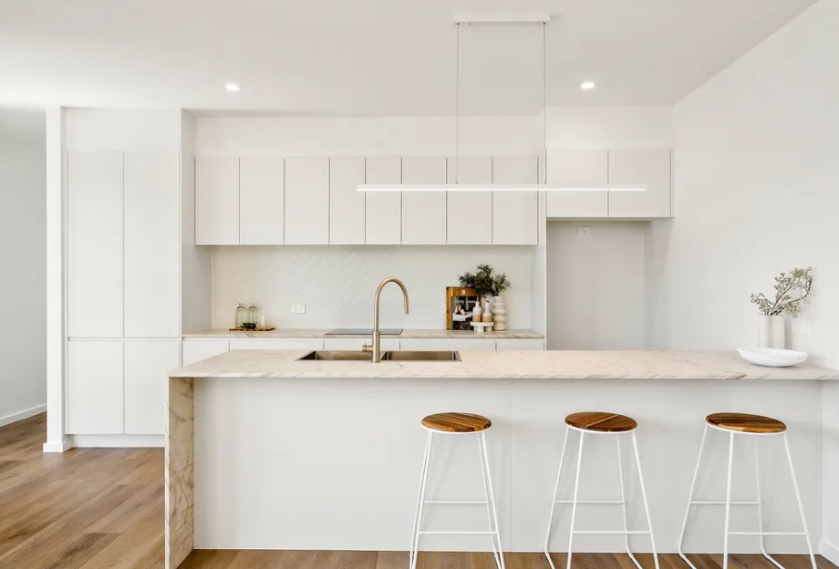 Spacious kitchen design with contemporary cabinetry and layout