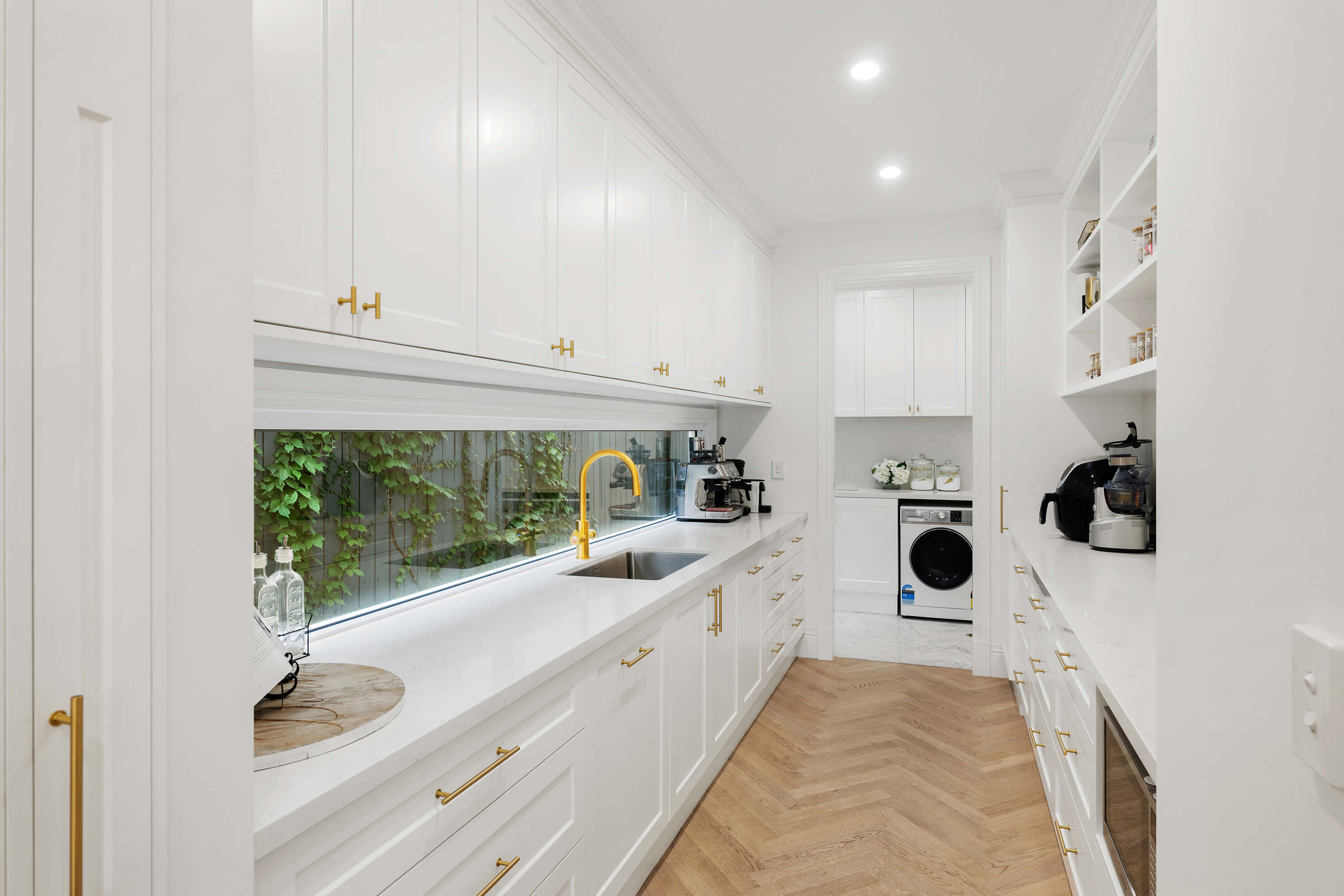 Open plan kitchen with island bench and premium finishes