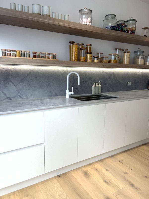 Modern kitchen design in Shell Cove with light coastal finishes