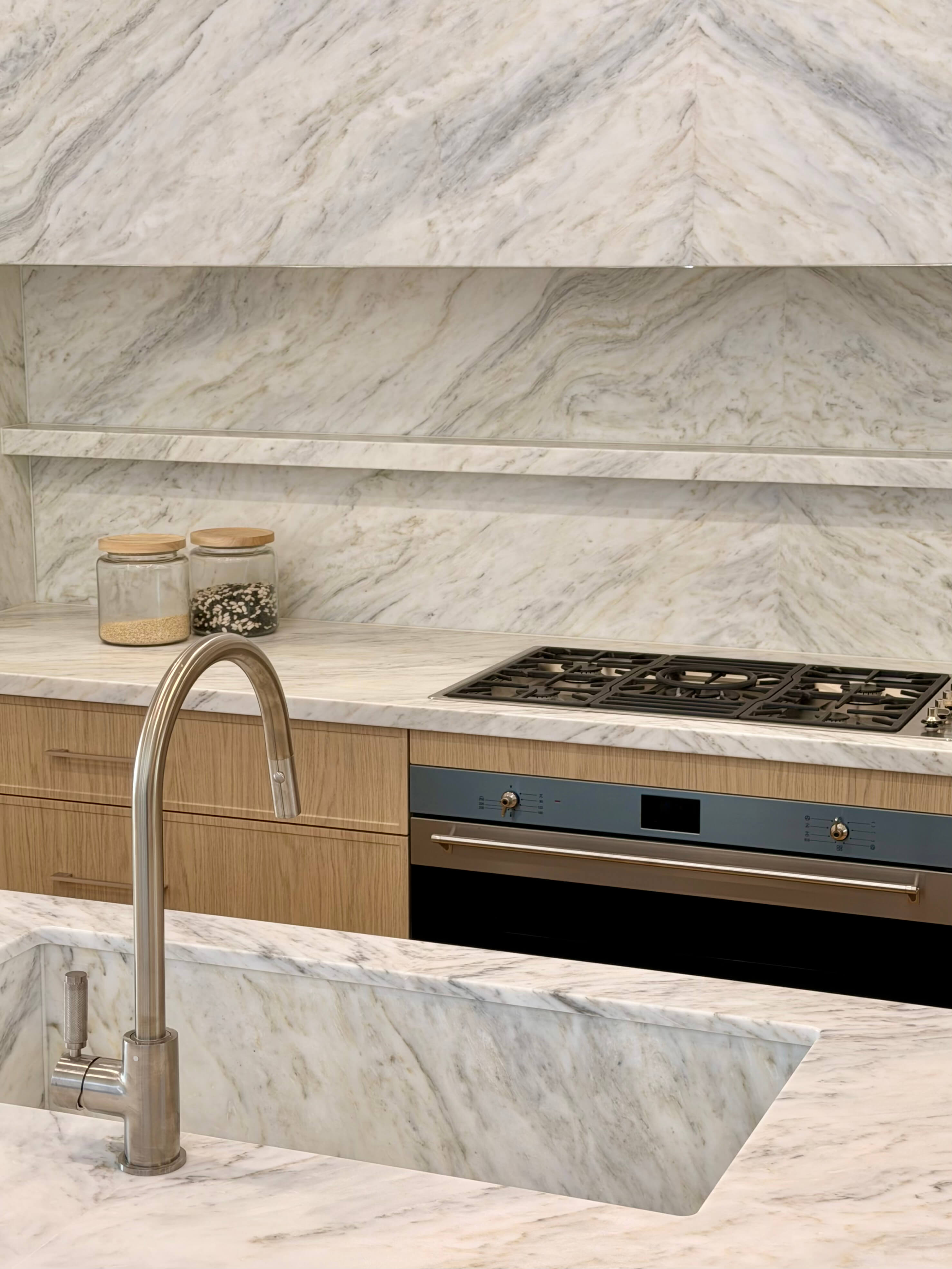 Kitchen with modern natural stone and custom joinery