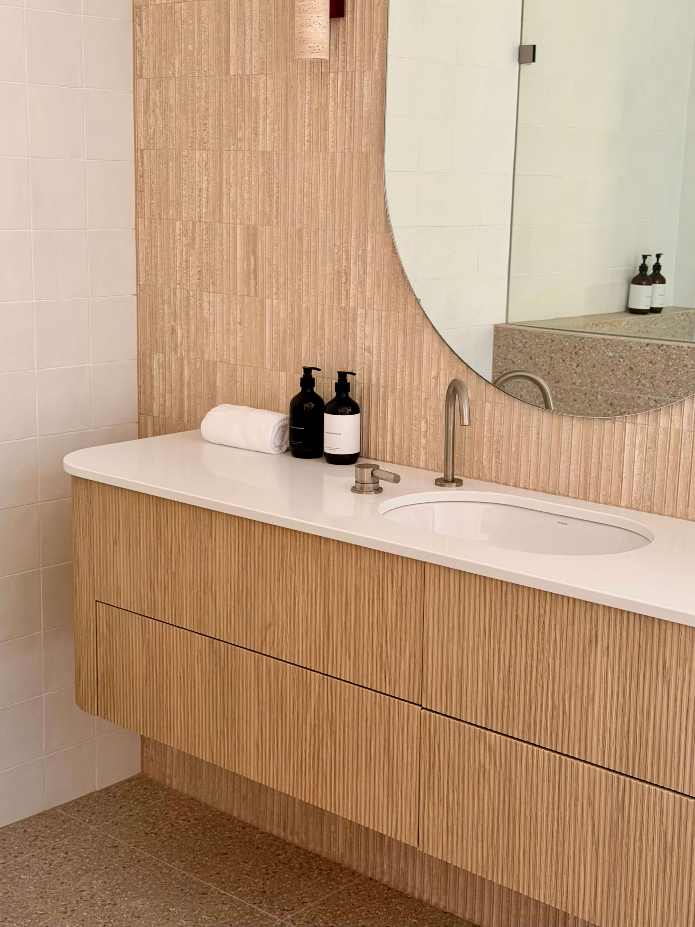 Contemporary custom vanity cabinetry showcasing a modern sink and handcrafted joinery