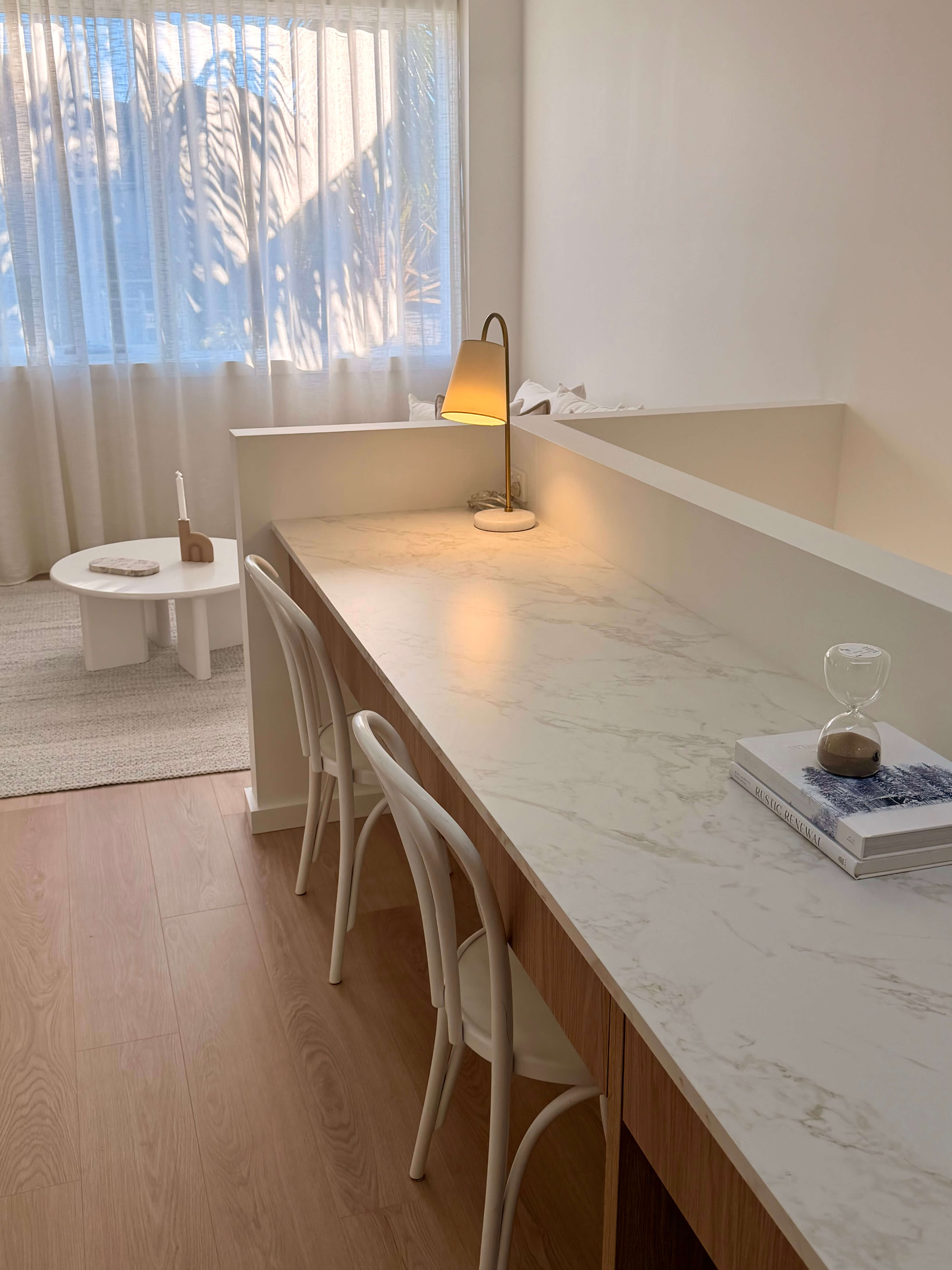 Modern multi-user study area featuring a marble desktop, built-in drawer storage and custom joinery.