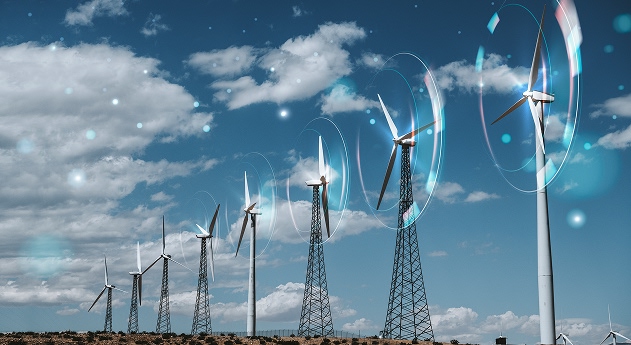Linha de turbinas eólicas sob céu azul com nuvens, representando energia limpa e renovável.