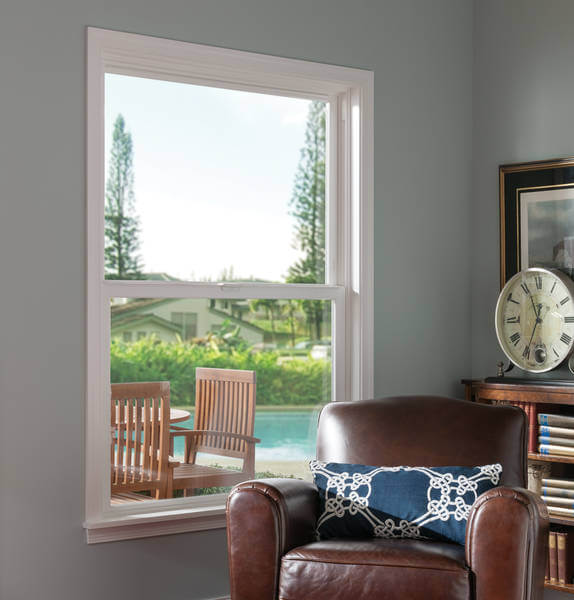 Milgard Tuscany double hung window white frame leading to a pool