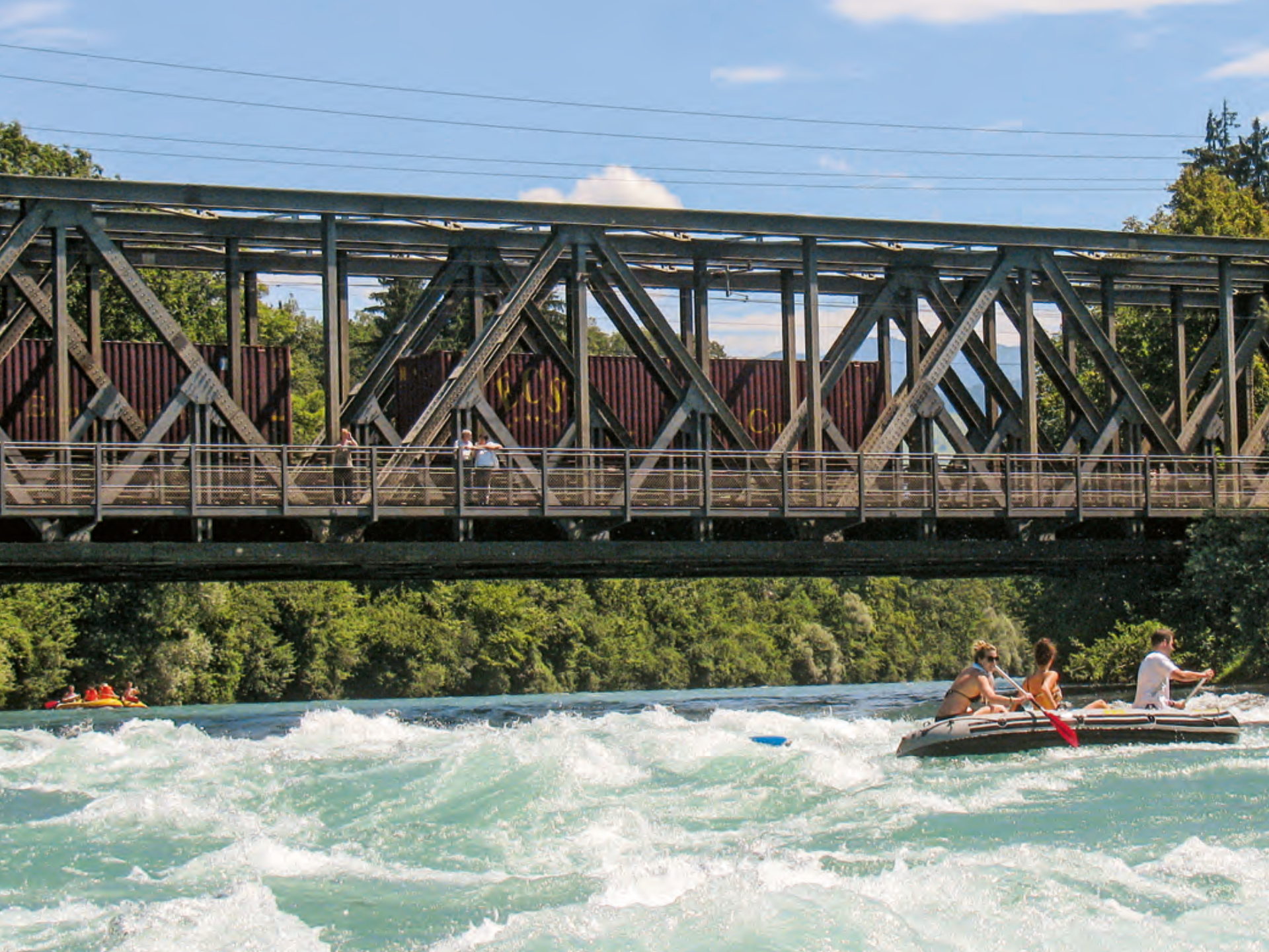 Wooden bridge over the Aare and a rubber boat