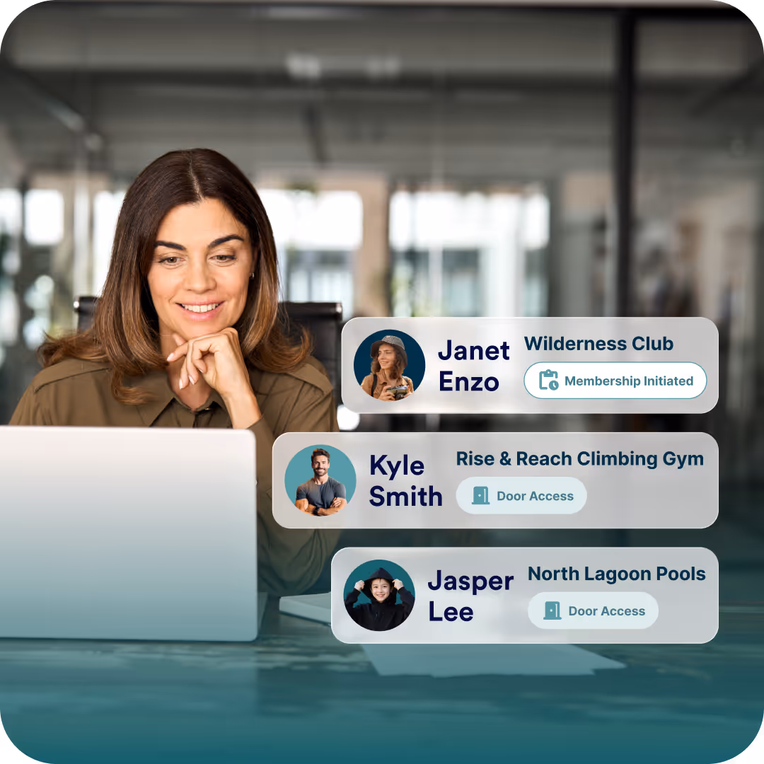 Woman using a laptop with digital chat interface overlays