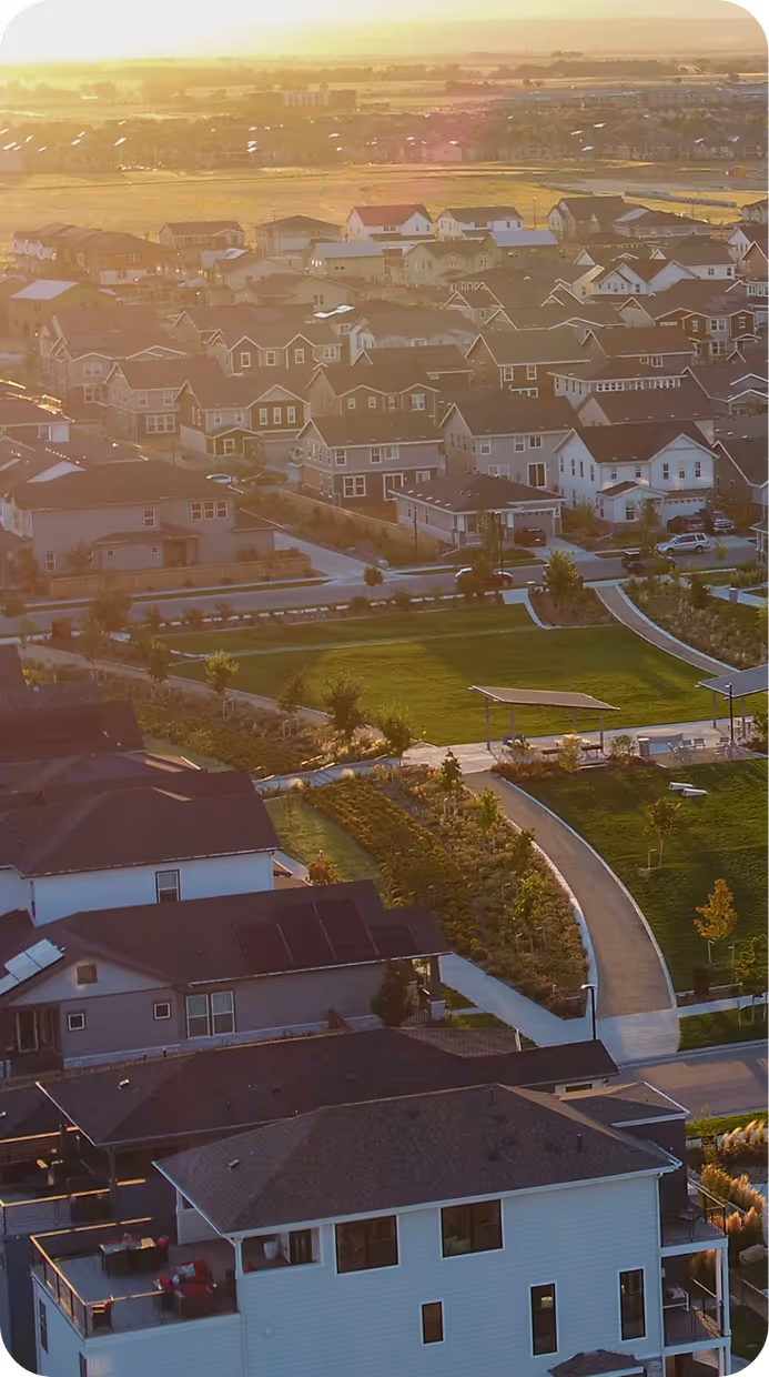 Aerial view of a residential community at sunset