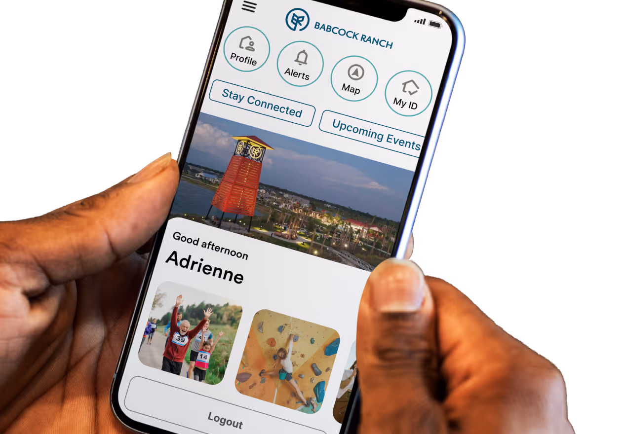 Hand holding a smartphone showing a community events and activities feed inside the Bellavara app.