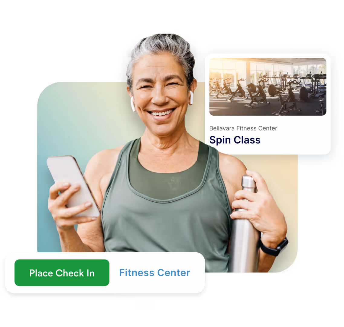 Smiling older woman in workout gear holding water bottle and phone with spin class check-in prompt.