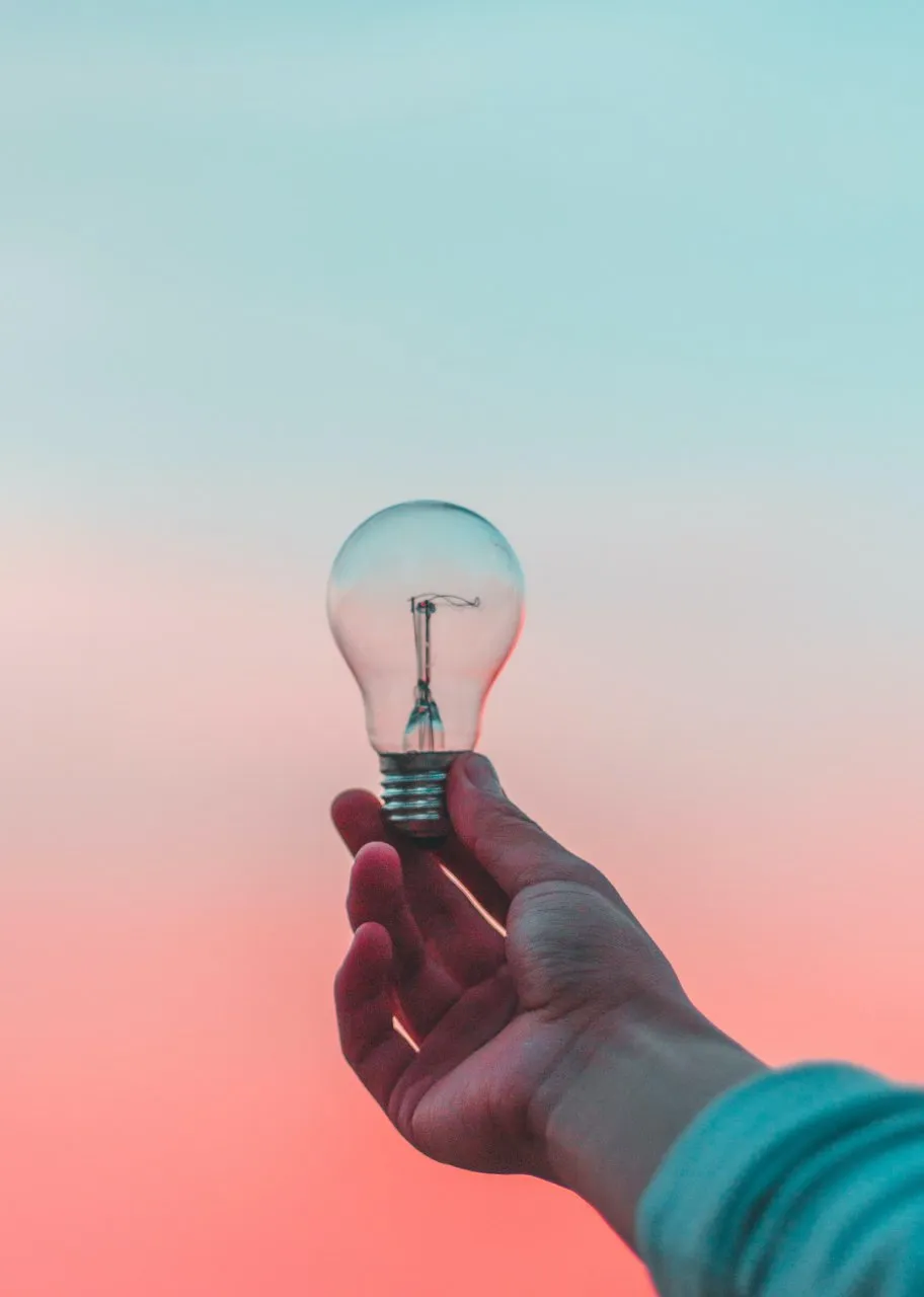 I light bulb on gradient background.