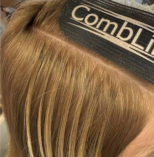 CombLine track sitting flat against golden blonde hair near the crown