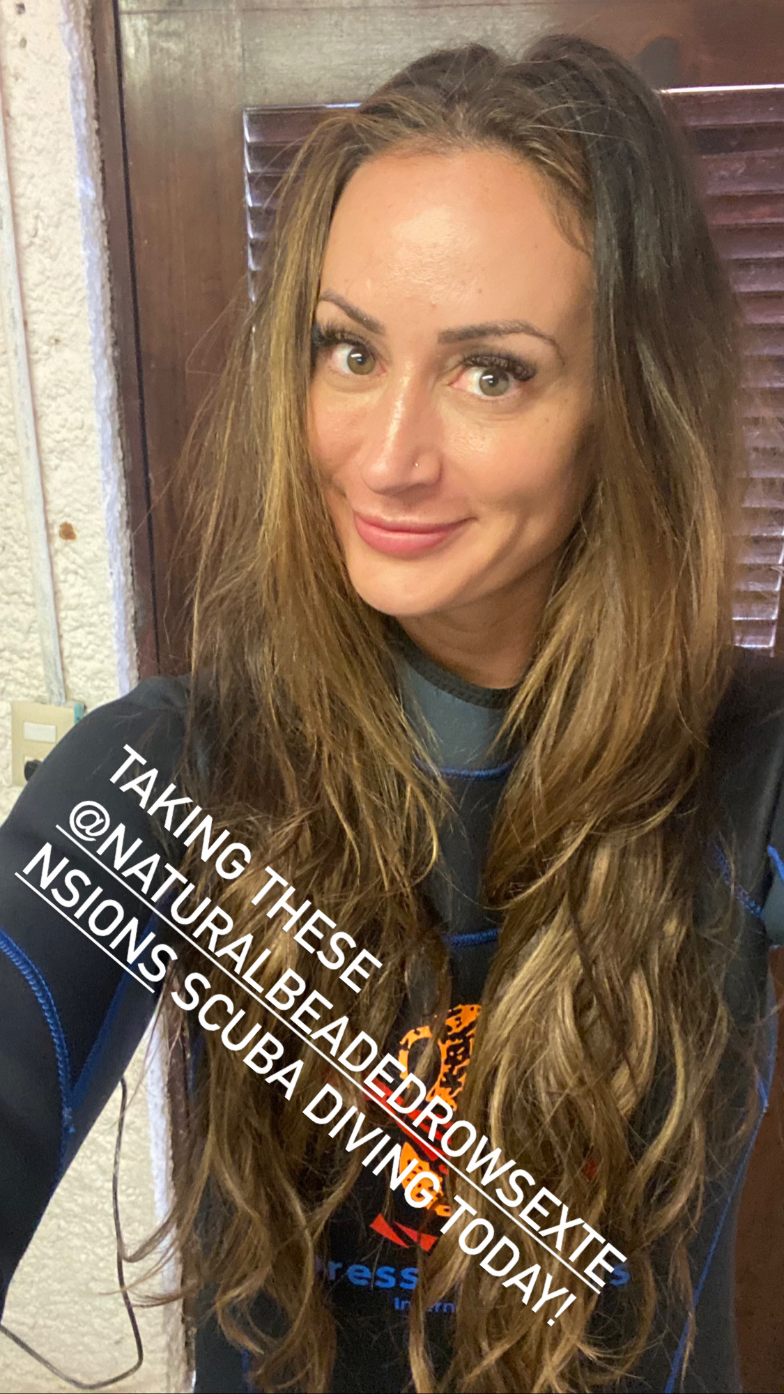 Shannon Reiley scuba diving while wearing her Natural Beaded Row hair extensions