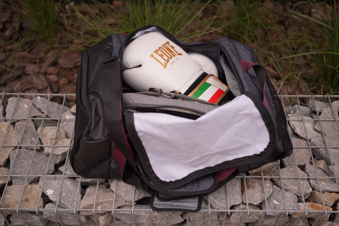 an open gym bag with boxing gloves inside