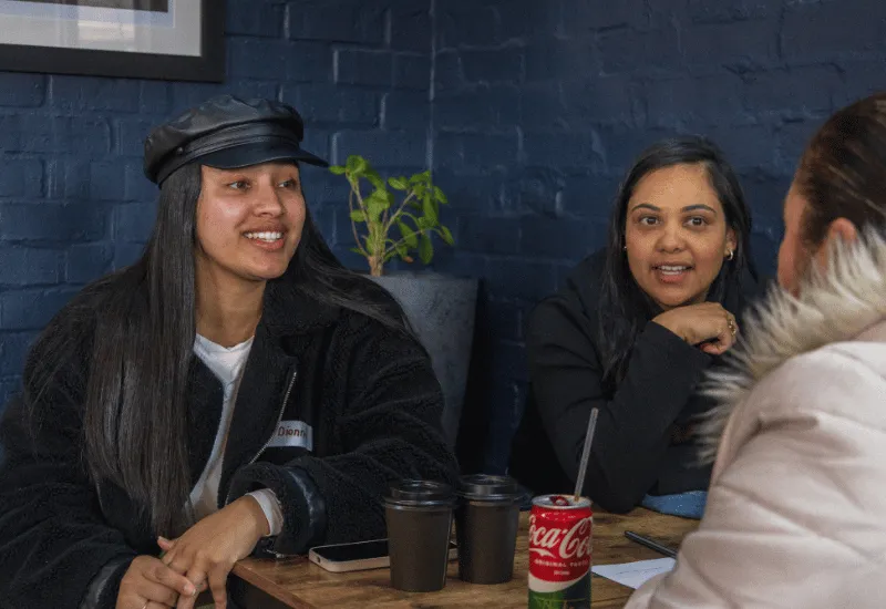 Women chatting and enjoying each others company.