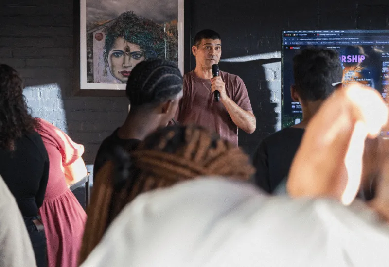 Leader sharing a message at our young adults gathering.