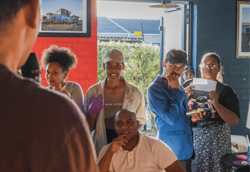 Young adults gathering together and having fun.