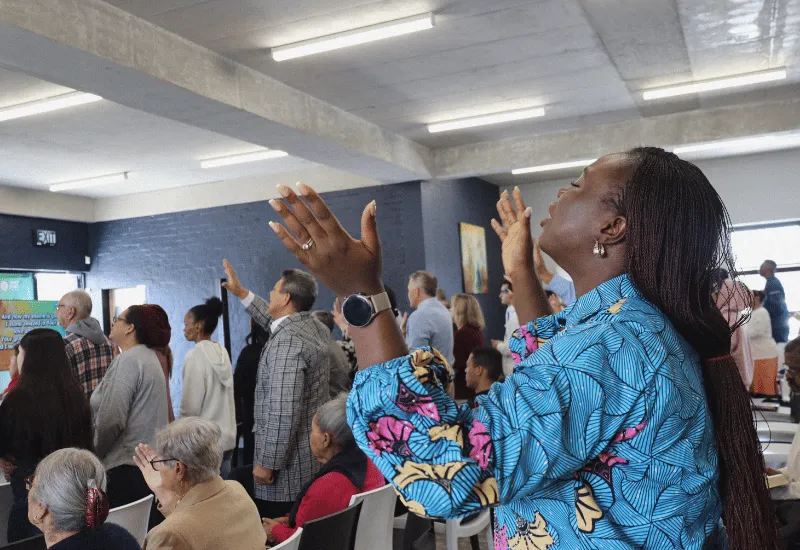 Women worshiping during the service.