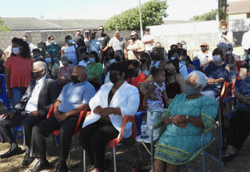 Apostles and their wives sitting together at the groundbreaking ceremony.
