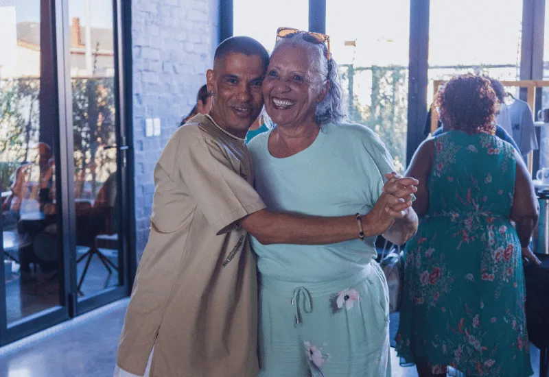 A man and women hugging before the service.