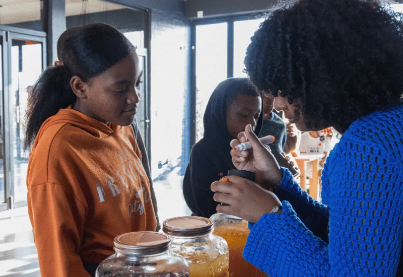 Serving juice at a youth gathering.