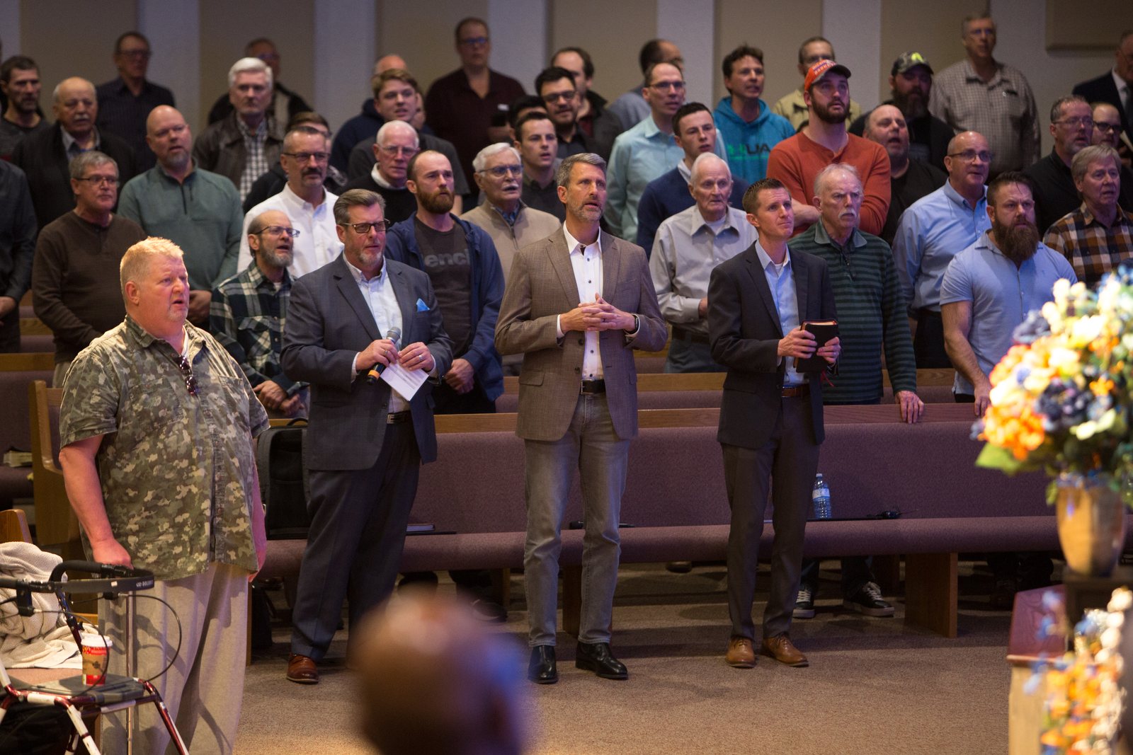 Men singing together