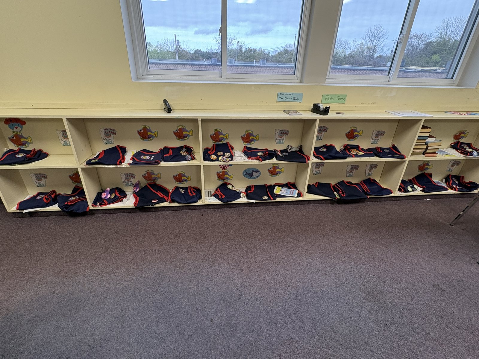 Club vests waiting in the cubbies