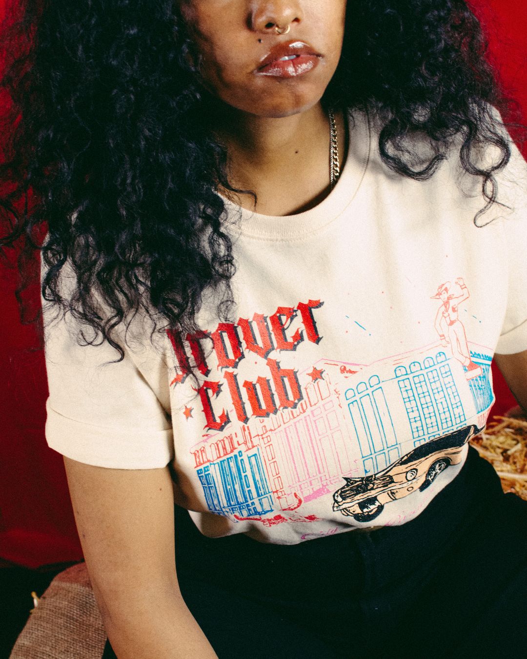 Woman wearing Drover Club City of Paradise tee in natural with vintage car and cowboy graphic, Americana style look