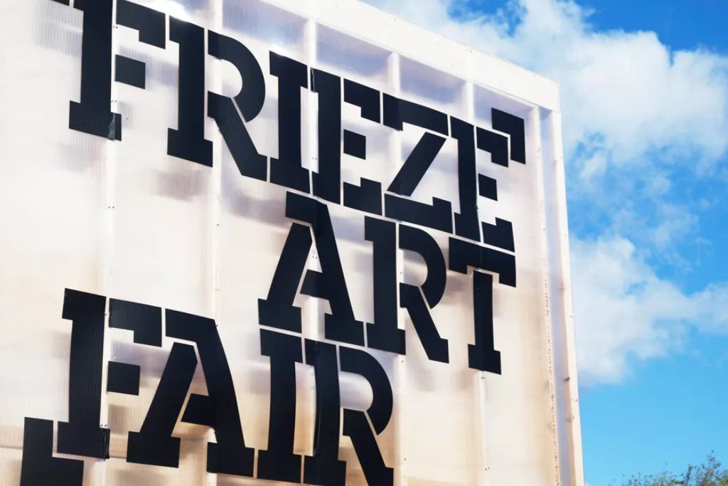 Entrance sign at Frieze Art Fair during a contemporary art gallery opening.