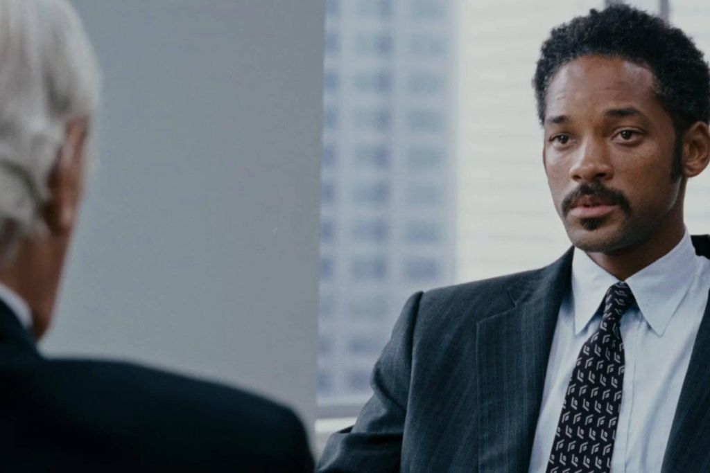Professional candidate attending a formal job interview in a modern office environment.